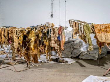 Belongings of the dead that were unearthed with their bodies hung up to dry at the Krajina Identification Project. It is here that the remains of people murdered during the Bosnian wars are identified...