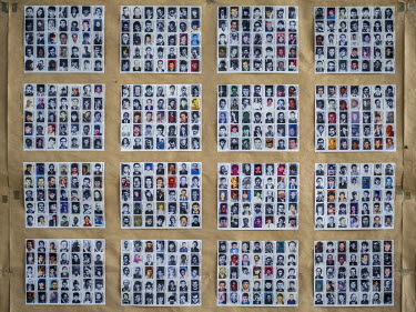 Photographs of people missing from the war at the Krajina Identification Project. It is here that the remains of people murdered during the Bosnian wars are identified.