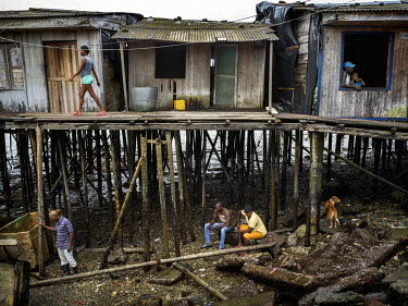 People and housing in Puente Nayero, a slum area home to more than 1200 families. An estimated 95 percent of the residents have been forcibly displaced from their original homes due to the conflict wi...