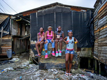 From left: Gina Natalia Garces, 12, Lesli Mayesi Viueros, 12, Ani Michel Duran, 11, and Eblin Yazury Valenua, 14, in Puente Nayero, a slum area home to more than 1200 families. An estimated 95 percent...