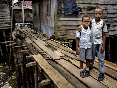 Two boys going home after attending school in Puente Nayero, a slum area home to more than 1200 families. An estimated 95 percent of the residents have been forcibly displaced from their original home...