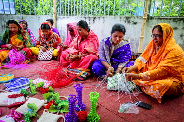 Women receiving handicraft making training.