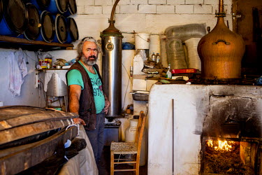 A man distilling in a Raki in Maza, a mountain village.