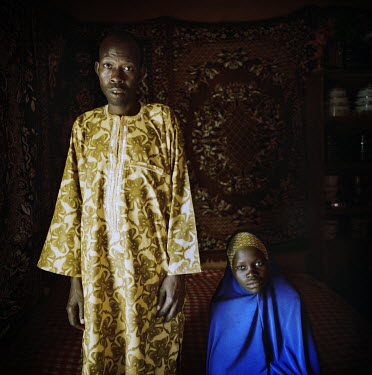 Chitou Saley, 41, and Sailouba Siradji, 17, have been married for one year. She is his second wife. Chitou's first wife gave birth to three children. They plan for Sailouba to get pregnant. 'It is imp...