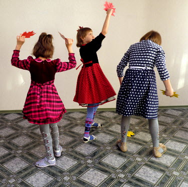 Girls playing in Druzhkovka Children's Home. The home is for children with cerebral palsy, for children with mental disabilities, and for disabled youth and adults up to age of 35.