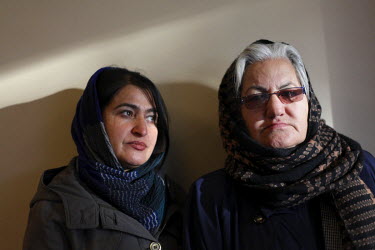 Ogai Amail, 40, left, with accomplished fellow poet, 55 year old widow Gulalai Omerkhel, at their shared home in the Microryan District of Kabul. They both belong to Mirman Baheer, a female literary s...