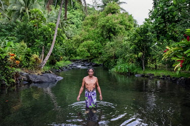 Tuiafutea Vaafusuaga, 57, a chief (matai) of Falease'ela-tai Village standing in Liua le Vai o Sina River. After the river dried up in 2011 due to drought he and a group of other village chiefs formed...