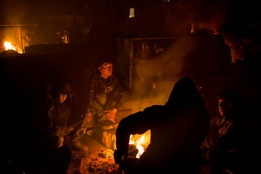 As temperatures outside fall to minus 20 Celsius migrants and refugees living in a squalid former barracks on the outskirts of Belgrade make fires using old railway sleepers as fuel. However, the wood...