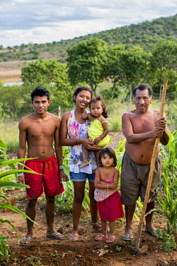 Indigenous Kiriri, Ines Terodoro dos Santos, 17, centre with her daughters, Eliara, 14 months, top, and Isabel, 3, her husband, Edmeilson Jesus dos Santos, 20, left, and his farther, Daniel Silverio d...