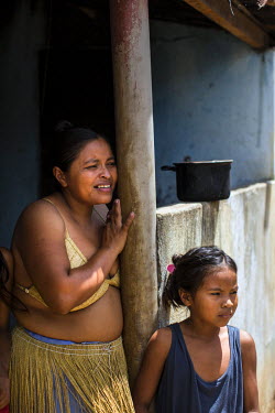 Indigenous Kiriri, Ebaldina Jesus Santiago, 35, with her daugher, Dariana, eight, outside their home in Aldeia Marcacao Kiriri.   In 1995, after years of fighting for their rights, the Kiriri indigeno...
