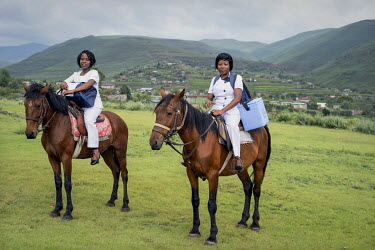 Nurses on horse back supplying medical services in the remote and rugged Thaba-Tseka district.