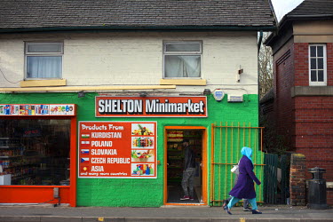 A shopsign for the Shelton Minimarket offers products from numerous East European, Middle Eastern and Asian countries.