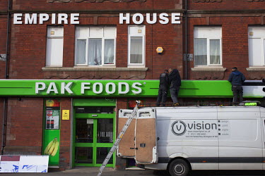 A shopsign for Pak Foods is fitted to a shop in Empire House.