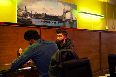 Young men in the Peshmarga Cafe in the city centre.