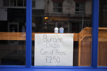 A sign in a cafe window in the Hanley area of the city advertises a cheap meal offer.