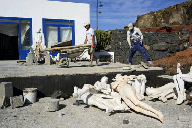 Workmen move among the seemingly discarded sculptures at artist Jason deCaires Taylor's studio. Taylor was commissioned to build his Lanzarote underwater museum after completing similar projects on th...