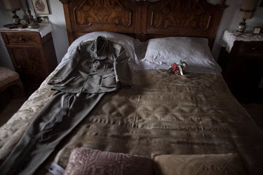 Mussolini's bed and the uniform he wore a few days before he was executed at the Villa Carpena, Mussolini's family home and now a museum to the dictator and a popular place among and fascists and righ...