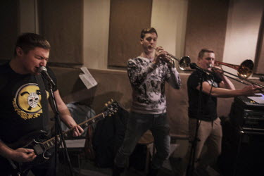 Slava (33), Pavel (30), Evgeniy (29), Anton Cheh (33), Antonio (30) and Alex (35) rehearse in a basement. The right-wing group has toned down their most extreme lyrics, but they still perform songs ab...
