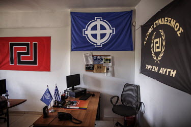 The offices of Golden Dawn, Greece's far right, ultra-nationalist party, with its wall decorated with the party's emblem and the symbol of the White Pride movement.