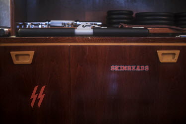 A nazi symbols in the clubhouse of the National Socialist group KNS (Committee for Nation and Freedom). In their clubhouse in a Moscow suburb its members workout, shoot using handguns, train to fight...