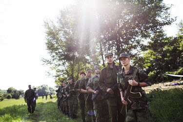 Members of the aggressively nationalist paramilitary, Slovenski Branci, training, with wooden guns,  in the forest, a two hour drive from the Slovakian capital. Youths in the group, some as young as 1...