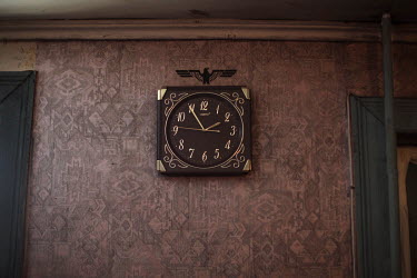 A nazi symbol above a wall clock in the clubhouse of the National Socialist group KNS (Committee for Nation and Freedom). In their clubhouse in a Moscow suburb its members workout, shoot using handgun...