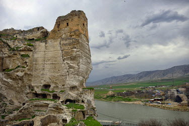 Old Hasankeyf Castle and cave houses above the Tigris River. 80% of the town of Hasankeyf will be submerged beneath 60 metres (200 feet) of water following the completion of the Ilisu hydroelectric da...