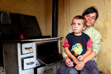 A Roma mother and her child. The family lives in extreme poverty and, until assisted by a charity and social services, had neither financial means nor awareness of the boy's needs to take him to a pri...