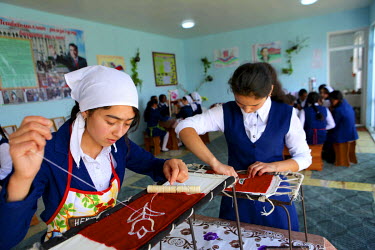 Girls learning embroidery at a school in Khistevarz where youths aged 15 and 16 learn practical life skills.