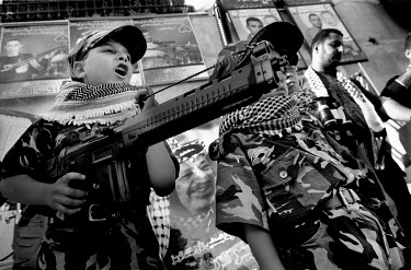 Child militants at an event in the Balata refugee camp showing solidarity with the people of Gaza who are undergoing a siege by Israeli forces.