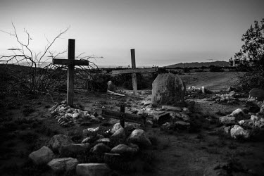 Graves in Slab City's cemetery. Slab CIty is a squatters' camp about 190 miles southeast of Los Angeles.   Slab City, known as The Slabs, is named for its areas of concrete where for many years, since...