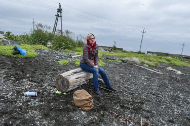 Irina, a worker at the local fish processing factory 'Narody Severa', during a picnic on Oktyabrsky beach. On stormy days the factory closes and many of the workers enjoy the free time at the beach ha...