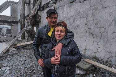 Marina and Ruslan stand beside a derelict building as they have a picnic on the beach on a day off. They both work at the local fish processing factory 'Narody Severa'. On stormy days the factory clos...