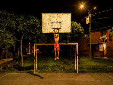 Didiller Angulo, 9, on the basketball court.People only moved to Potrero Grande about 10 years but the neighbourhood is already considered one of the most troubled in the country. Extreme poverty, une...