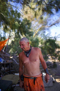 '77' has been living in Slab City, a squatters' camp about 190 miles southeast of Los Angeles, for the past two years. He calls himself as one of the 'Pirates' of Slab City.   Slab City, known as The...