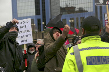 Anti-racism activists protesting along the route of a march held by the far-right 'Britain First' group. More than 150 members of the far-right 'Britain First' group gathered at Telford Central statio...