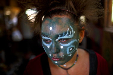 39 year old Connie with her face painted. She says she was sexually assaulted by adults as a child and has been living in Slab City, a squatters' camp about 190 miles southeast of Los Angeles, for alm...