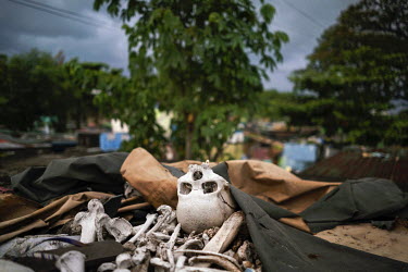 The remains of somebody once buried are left on the top of a tomb in Manila North Cemetery. The standard contract for renting tomb space is five years and if family members don't keep up payments, the...