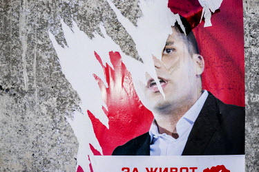 A ripped election poster.
