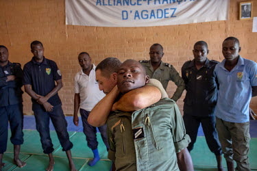 A EUCAP instructor, teaching on an European Union funded training course, shows police officers types of restraint holds they might have to use in the arrest of smugglers. The European Union, through...