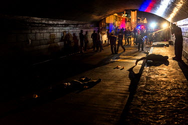 Crime scene investigators collect evidence and remove the bodies of Cyril Raymundo, 29, Eduardo Aquino, 44, and Edgar Cumbis, 47, who were killed in a police anti-drug operation on 6 December 2016.