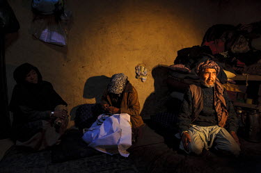 A family at their home in the Maslakh Refugee Camp where the daughter is doing some embroidery. Located approximately 20km from Herat in remote western Afghanistan the camp was once the largest in the...