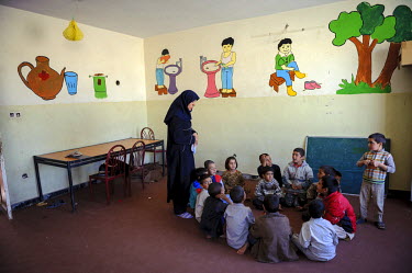A teacher with her students in an orphanage.