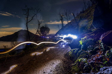 In the early hours of the morning, sulphur miners carrying torches make their way up a dirt track to the summit of the Ijen Volcano. More than 200 people come here daily to collect sulphur, which occu...