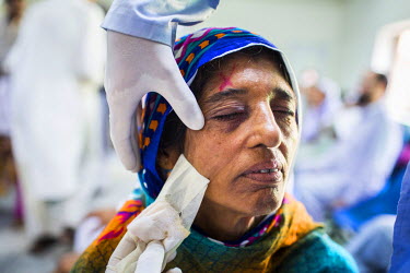 Kausar Shaheen has her bandage removed a day after her cataract operation at the LRBT Eye Hospital in Mandra.