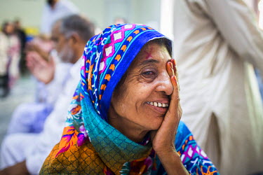 Kausar Shaheen smiles after having her bandage removed a day after her cataract operation at the LRBT Eye Hospital in Mandra.