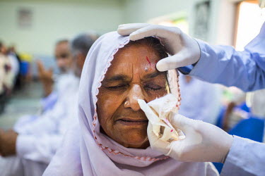 Zamurrad Bibi has her bandage removed a day after her cataract operation at the LRBT Eye Hospital in Mandra.