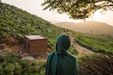 Kausar Shaheen looks out over the hills around her home in Manhiala, Chakwal District. Before her cataract operation Kausar was unble to see the electricity pole in the distance or the brick building...