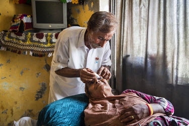 Tariq Bibi (55) puts eye drops into the eyes of his wife Zamurrad (55) who has recently had the first of two operations to remove cataracts from both of her eyes. Her vision was deteriorating consiste...