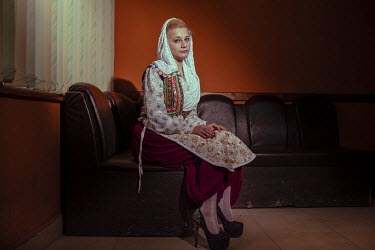 A young Pomak (Muslim) woman dressed up, just before she sets off to take part in celebrations for a wedding.